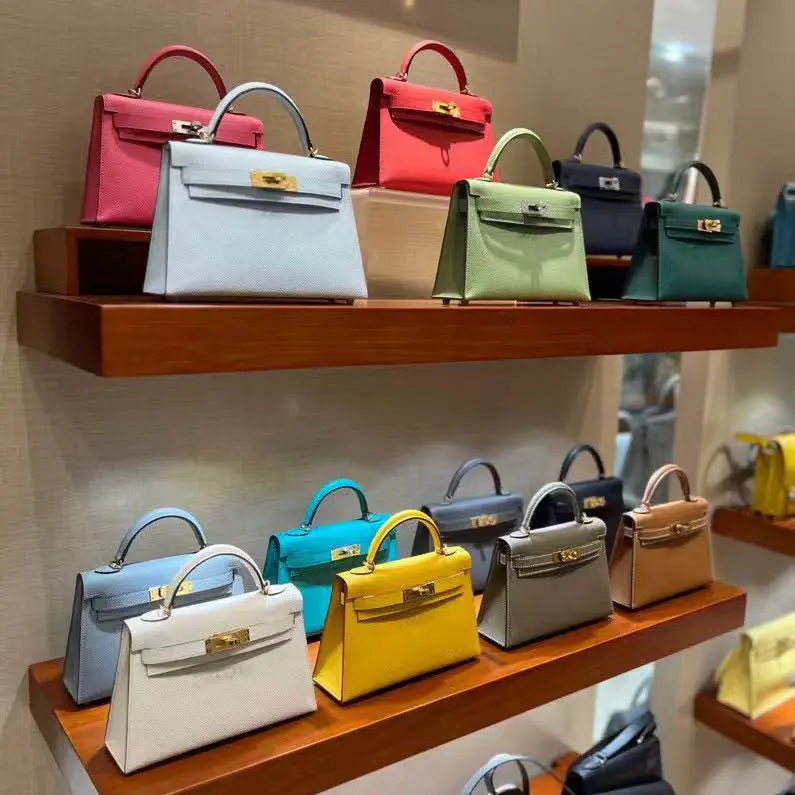 Luxury replica Hermes Kelly bags displayed in boutique-style setting at Replica Hermes Handbags Online Store