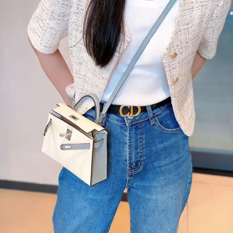 white replica hermes kelly 19cm epsom leather bag styled on model