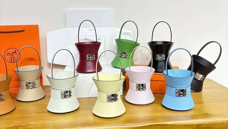 10 popular Hermès Mini Medor replica colors including noir, gold, and étoupe