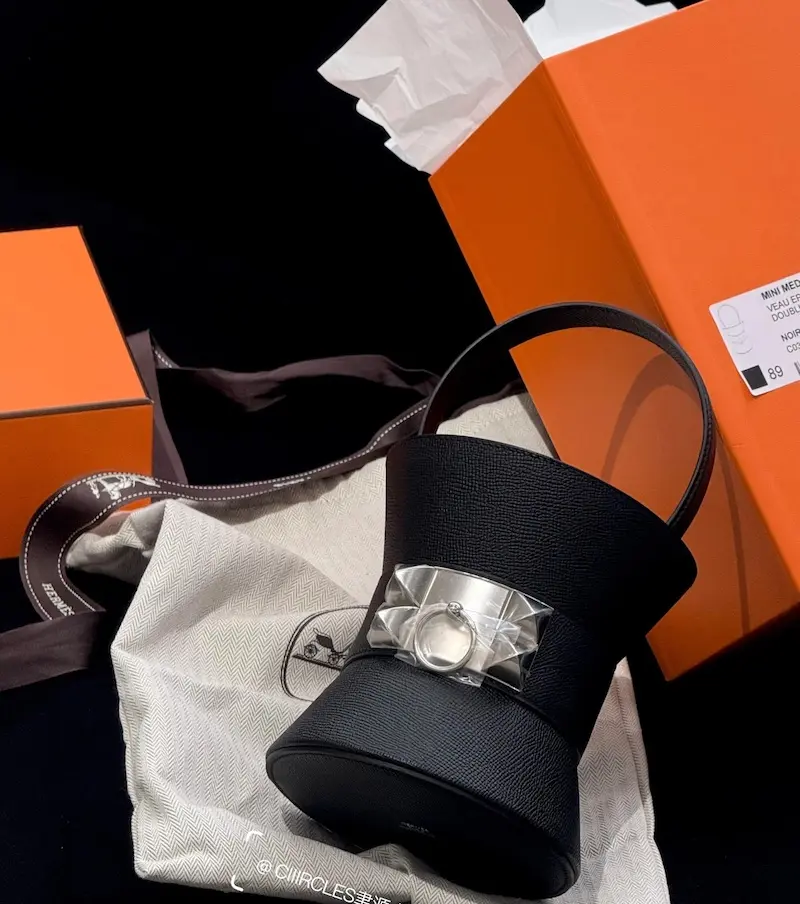 Black Epsom leather Mini Medor replica with full luxury packaging: orange box and dust bag