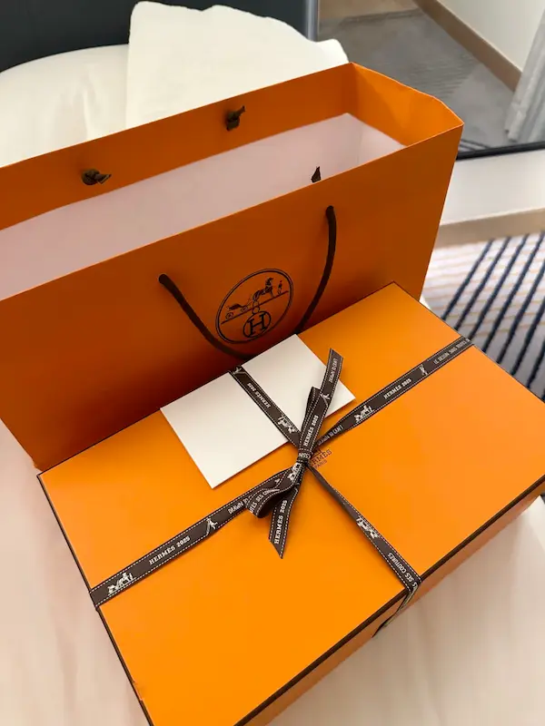 Luxury replica Hermes sneaker packaging - orange gift box and shopping bag