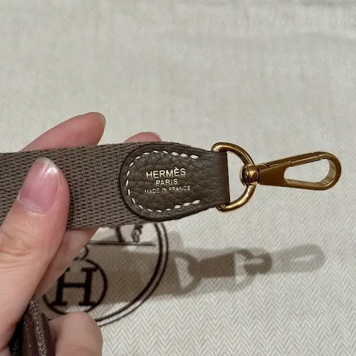 Hermes Paris logo stamp on canvas strap of Evelyne TPM replica bag
