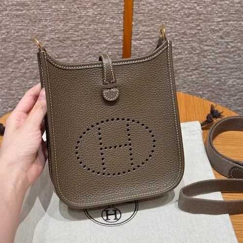Front view of Etoupe Hermes Evelyne TPM replica bag in Clemence leather