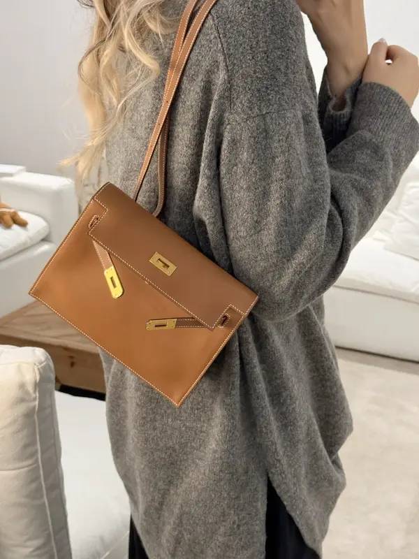 Gold Togo Leather Replica for Professional Settings Golden Brown Replica Hermes Kelly Danse worn as shoulder bag with business attire