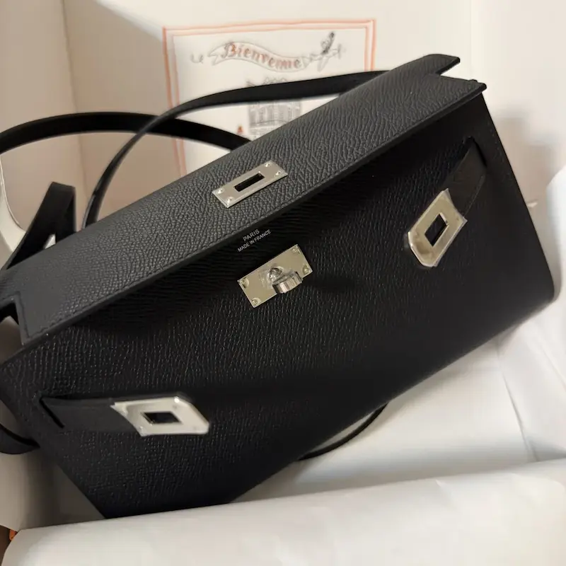 Close-up unboxing of black Epsom leather replica Hermes Kelly To Go Wallet