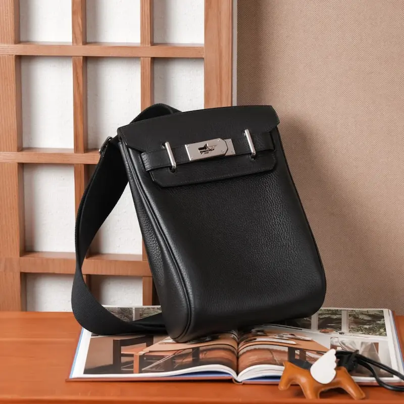 Classic black Replica Hermes HAC à Dos bag front view highlighting hardware