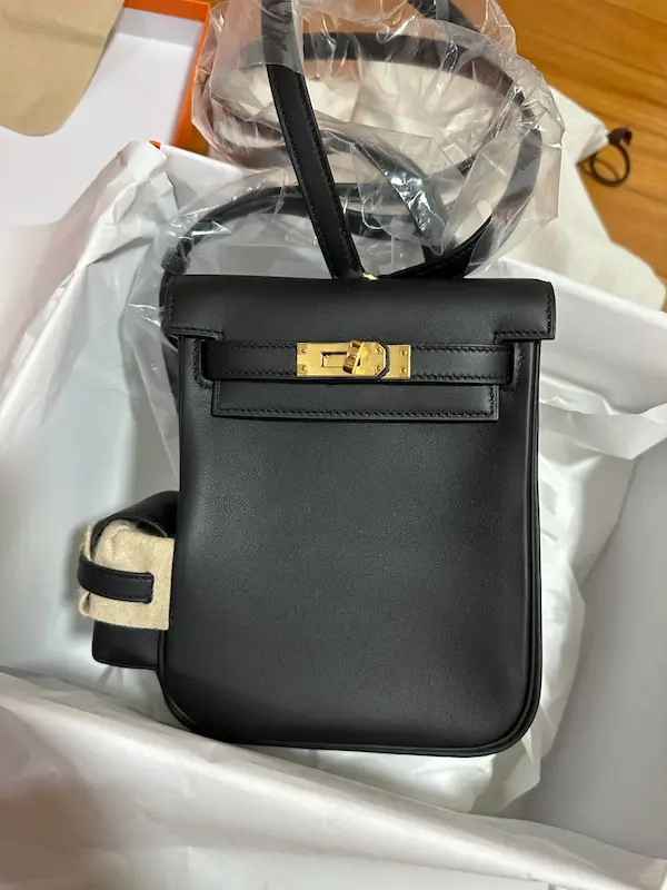 Close-up detail shot of Black Replica Hermes Kelly Jump Backpack with Gold Hardware