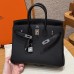 Side profile showing the sturdy silver sangles and plaqué on the best replica Hermes black Replica Handbag Store 25.