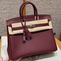 Best replica Hermes Rouge H Replica Handbag Store 25 with pristine silver hardware on the front clasp