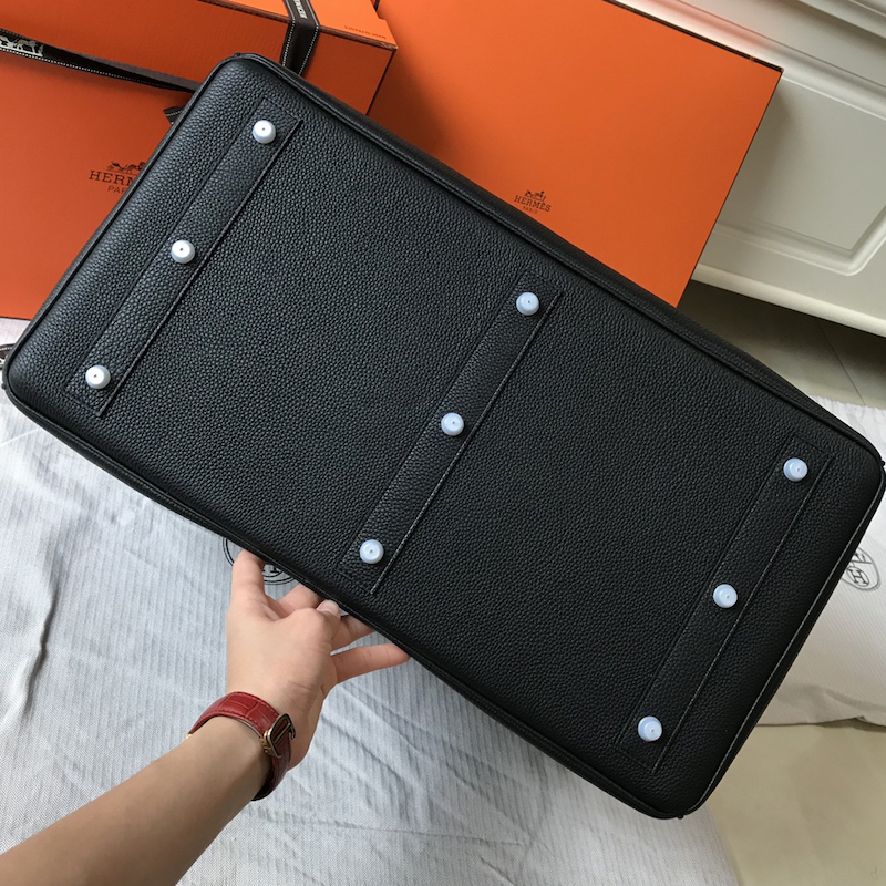 Macro view of diagonal saddle stitching on black Replica Handbag Store 50cm replica