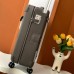 Replica Hermes R.M.S Cabin Suitcase in Etoupe shown in luxury travel setting.