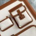 Close-up of the leather trim and metal rivets on the replica Hermes cabin suitcase.