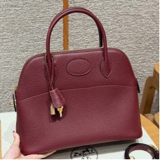 Replica Hermes Bolide 31 Bag in Rouge H Togo leather with zip-top closure.