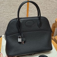 Replica Hermes Bolide 31 Bag in black Togo leather with zip-top closure.