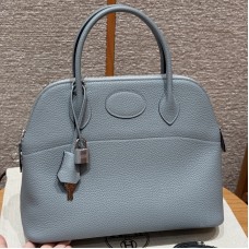 Replica Hermes Bolide 31 Bag in Blue Lin Togo leather with zip-top closure.