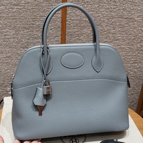Replica Hermes Bolide 31 Bag in Blue Lin Togo leather with zip-top closure.