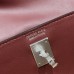 Inside lining and interior pocket of a black replica Hermes Kelly jump backpack