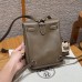 Back side view of Etoupe replica Hermes backpack showing rear pocket and construction