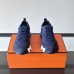 Replica Hermes Bouncing Sneaker side view, blue leather with signature H detail