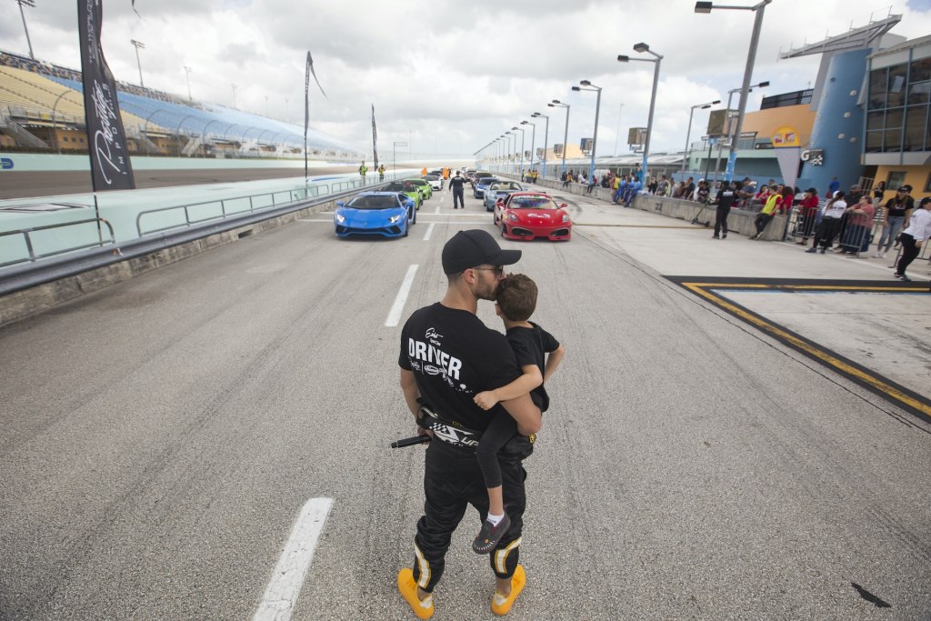 Brett David with child at 2019 track event